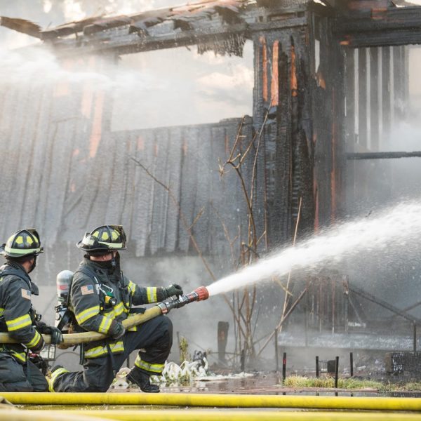 firefighter-sprays-water-on-burning-house-fire-2023-11-27-04-56-39-utc