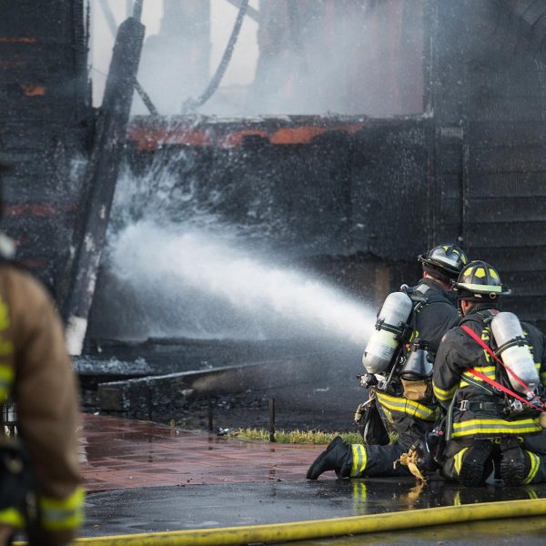 firefighter-sprays-water-on-burning-house-fire-2023-11-27-05-25-41-utc